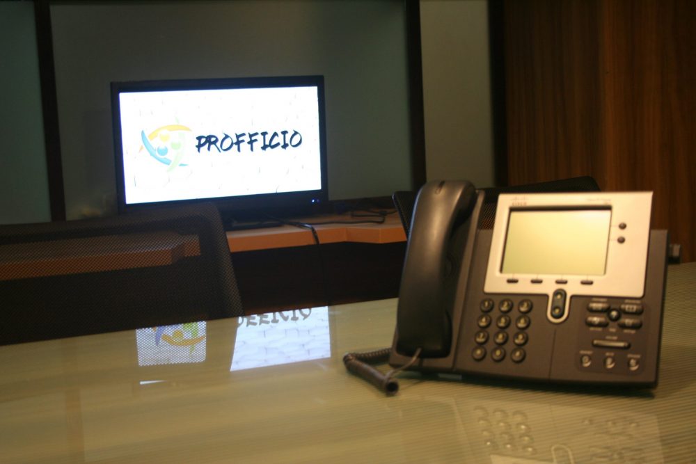 A conference phone in a Profficio meeting room